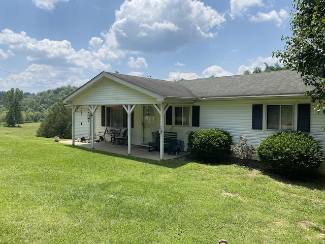 648 Hayes Creek Rd, Strunk, KY 42649 - back of property featuring a lawn and roof with shingles