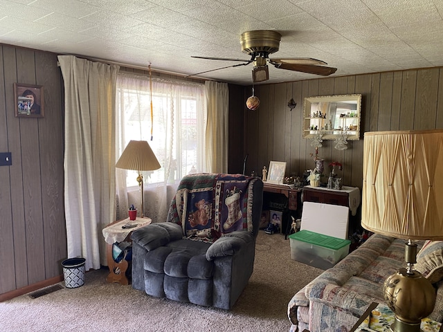 648 Hayes Creek Rd, Strunk, KY 42649 - carpeted living room with wood walls and a ceiling fan