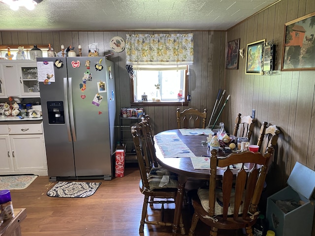 648 Hayes Creek Rd, Strunk, KY 42649 - dining room with wood finished floors and wooden walls