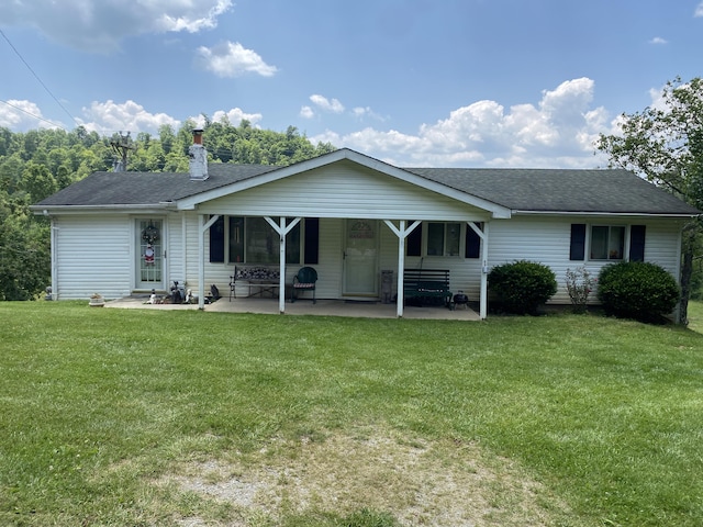 648 Hayes Creek Rd, Strunk, KY 42649 - rear view of property featuring a yard, a patio area, and a shingled roof