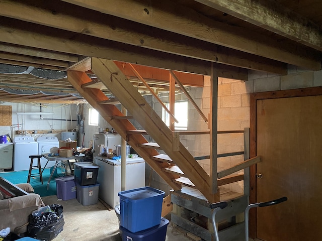 648 Hayes Creek Rd, Strunk, KY 42649 - basement featuring separate washer and dryer, stairs, and concrete block wall