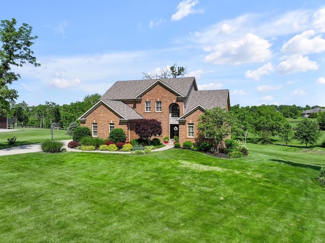 101 Sand Piper Ct, Midway, KY 40347 - traditional home featuring brick siding, a front lawn, and roof with shingles