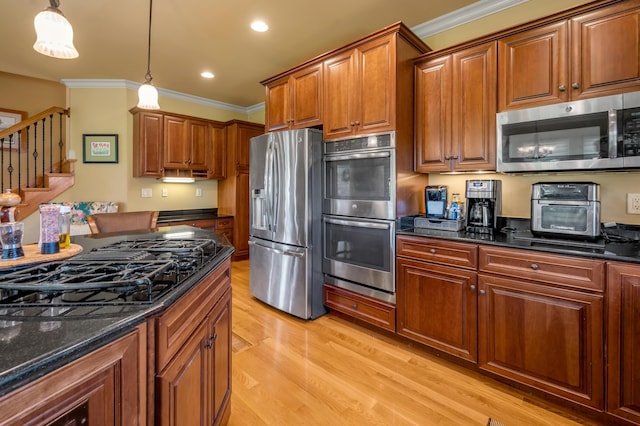 101 Sand Piper Ct, Midway, KY 40347 - kitchen with stainless steel appliances, light wood-type flooring, crown molding, pendant lighting, and brown cabinets