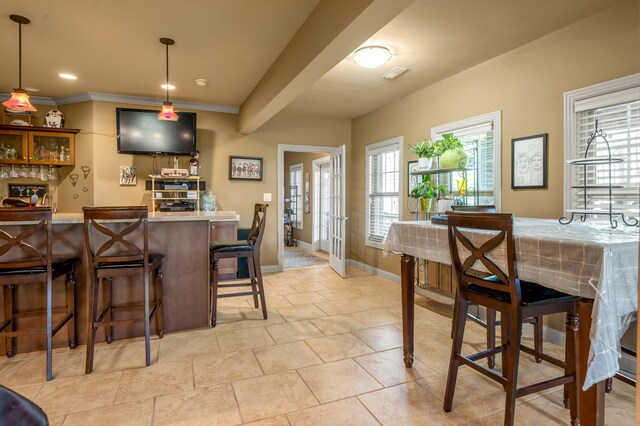 101 Sand Piper Ct, Midway, KY 40347 - indoor wet bar with ornamental molding, hanging light fixtures, baseboards, and light tile patterned floors