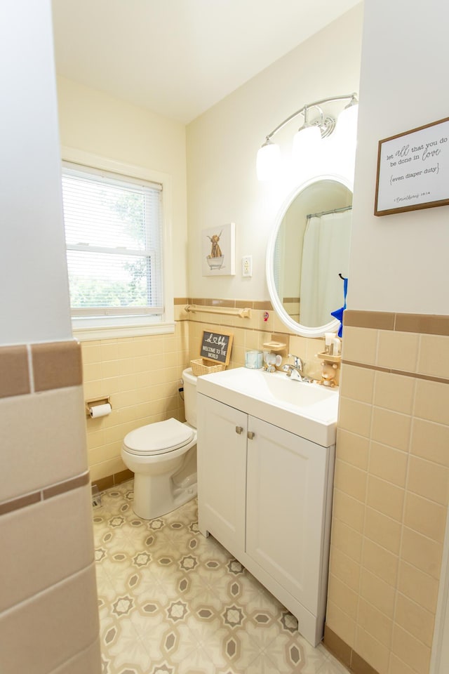 1021 Arapaho Trl, Frankfort, KY 40601 - bathroom with tile walls, vanity, wainscoting, and tile patterned flooring