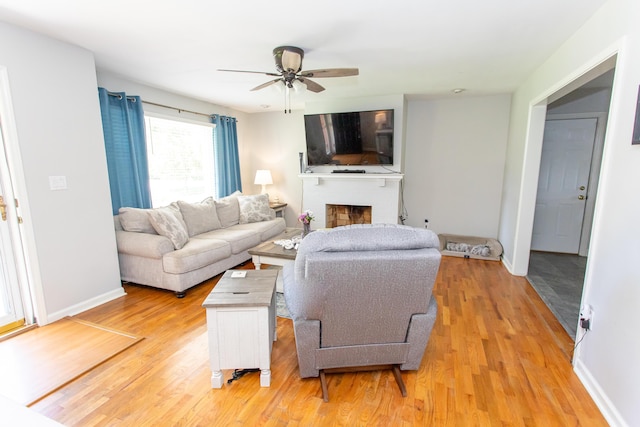 1021 Arapaho Trl, Frankfort, KY 40601 - living area with light wood-style floors, ceiling fan, and a fireplace