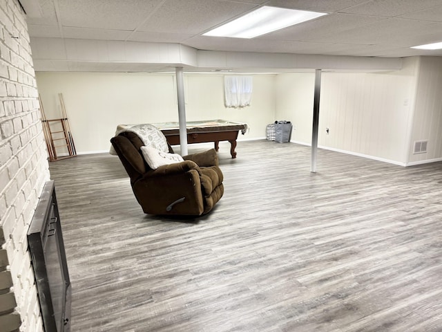 1021 Arapaho Trl, Frankfort, KY 40601 - living room with a fireplace, pool table, a drop ceiling, and wood finished floors
