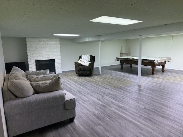 1021 Arapaho Trl, Frankfort, KY 40601 - living area featuring wood finished floors, a brick fireplace, and billiards