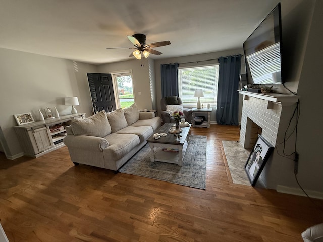 1021 Arapaho Trl, Frankfort, KY 40601 - living room featuring a ceiling fan, a brick fireplace, and wood finished floors