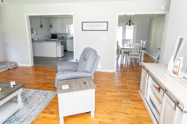1021 Arapaho Trl, Frankfort, KY 40601 - living room with a chandelier and light wood-type flooring