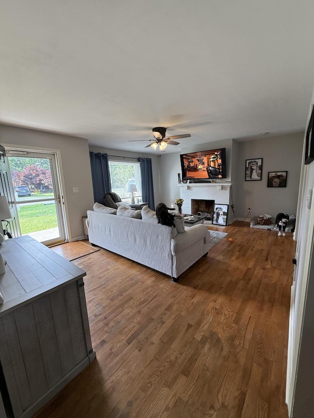 1021 Arapaho Trl, Frankfort, KY 40601 - living room with wood finished floors, ceiling fan, and a fireplace