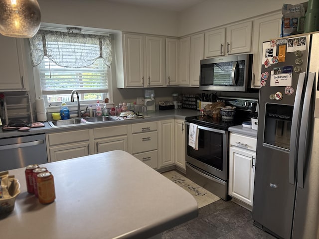 1021 Arapaho Trl, Frankfort, KY 40601 - kitchen with appliances with stainless steel finishes, a sink, and white cabinets