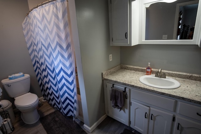1987 White Rock Rd, Mount Vernon, KY 40456 - bathroom with vanity, toilet, wood finished floors, and shower / bath combo with shower curtain
