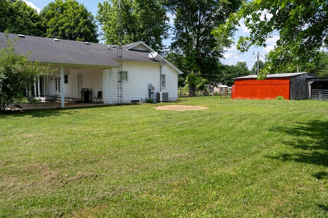 1987 White Rock Rd, Mount Vernon, KY 40456 - view of yard featuring central air condition unit, a patio area, and an outdoor structure