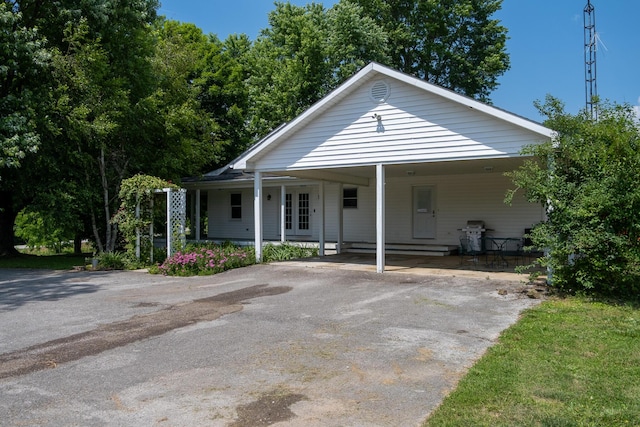 1987 White Rock Rd, Mount Vernon, KY 40456 - view of front of house with driveway, an attached carport, and french doors