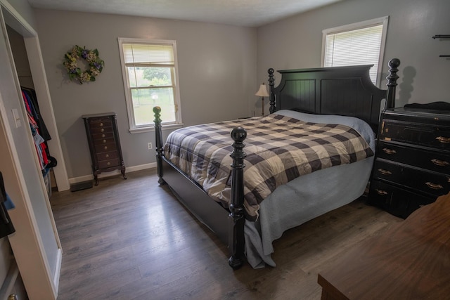 1987 White Rock Rd, Mount Vernon, KY 40456 - bedroom with multiple windows, wood finished floors, and baseboards