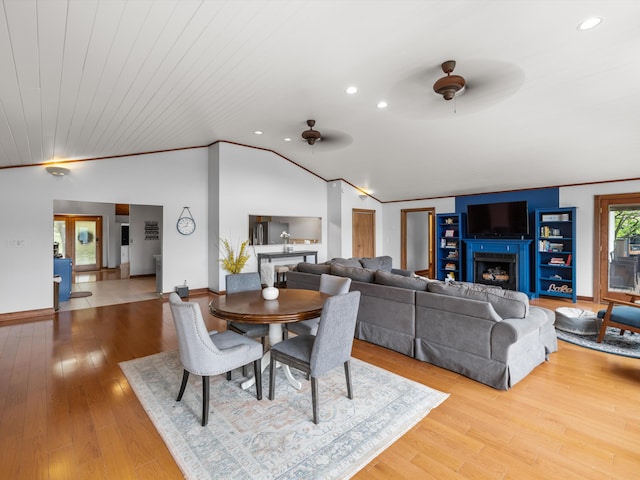 389 Lakeview Dr, Somerset, KY 42503 - dining room featuring ceiling fan, lofted ceiling, wood finished floors, recessed lighting, and a fireplace