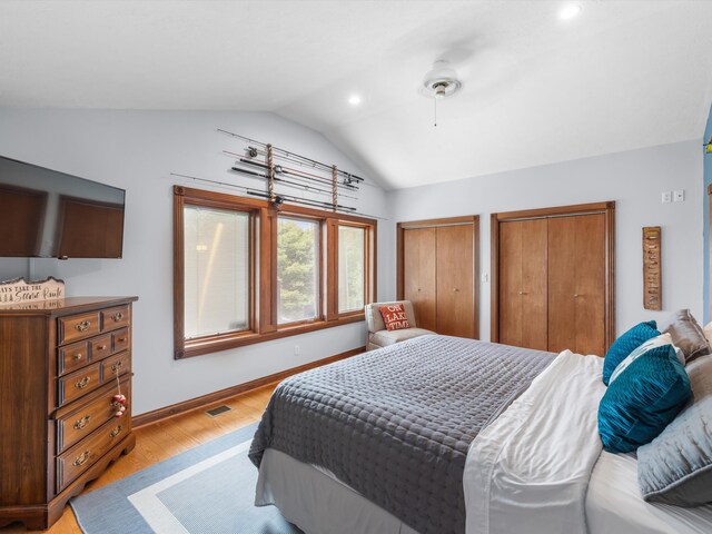 389 Lakeview Dr, Somerset, KY 42503 - bedroom featuring lofted ceiling, two closets, light wood-style flooring, recessed lighting, and baseboards