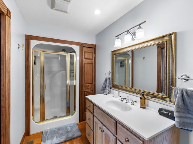 389 Lakeview Dr, Somerset, KY 42503 - bathroom featuring vanity, a stall shower, and wood finished floors