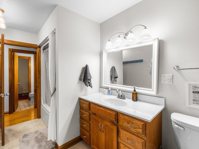 389 Lakeview Dr, Somerset, KY 42503 - bathroom with toilet, vanity, tile patterned flooring, and shower / tub combo