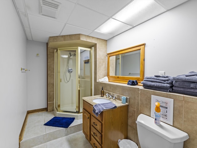 389 Lakeview Dr, Somerset, KY 42503 - bathroom with vanity, a shower stall, toilet, tile walls, and tile patterned flooring