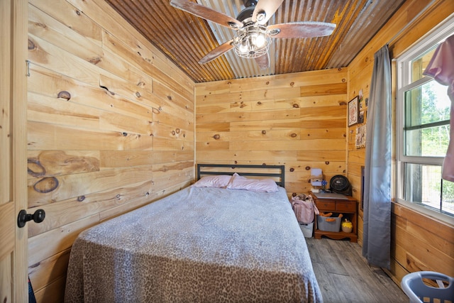 3402 Roundtop Rd, Strunk, KY 42649 - bedroom with wood walls, wood finished floors, wood ceiling, and ceiling fan