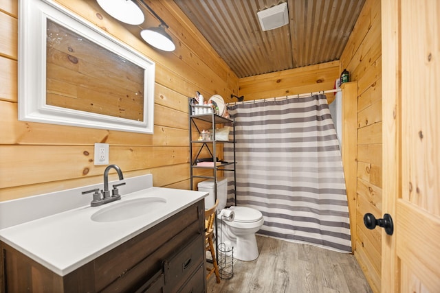 3402 Roundtop Rd, Strunk, KY 42649 - bathroom featuring wood walls, vanity, wood finished floors, toilet, and a shower with shower curtain