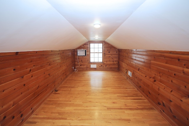 325 Dantzler Ct, Lexington, KY 40503 - additional living space with wood walls, a wall mounted AC, light wood-style floors, and lofted ceiling