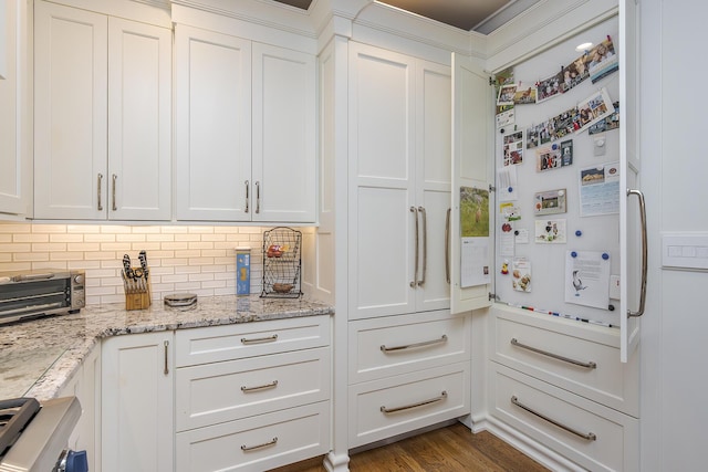 3513 Doral Pl, Lexington, KY 40509 - kitchen featuring white cabinetry, decorative backsplash, light stone countertops, and range