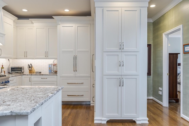 3513 Doral Pl, Lexington, KY 40509 - kitchen featuring white cabinetry, dark wood-style floors, ornamental molding, light stone counters, and recessed lighting