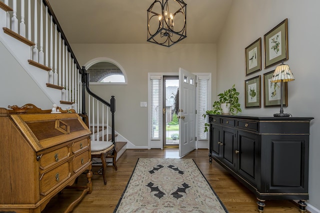 3513 Doral Pl, Lexington, KY 40509 - entrance foyer with plenty of natural light, stairs, a chandelier, and dark wood-type flooring
