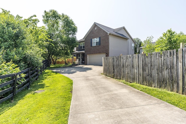 701 Sprucewood Dr, Lexington, KY 40514 - view of side of property featuring driveway, a garage, and brick siding