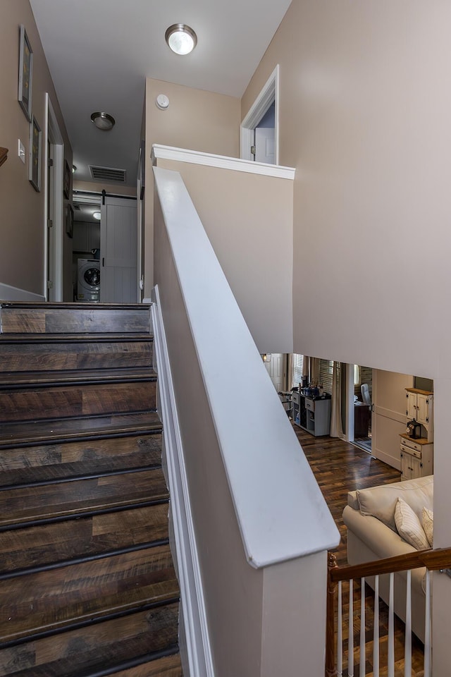701 Sprucewood Dr, Lexington, KY 40514 - staircase with washer / dryer, a barn door, and wood finished floors