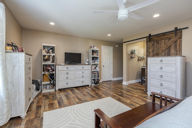 701 Sprucewood Dr, Lexington, KY 40514 - bedroom featuring dark wood finished floors, a barn door, recessed lighting, baseboards, and a ceiling fan