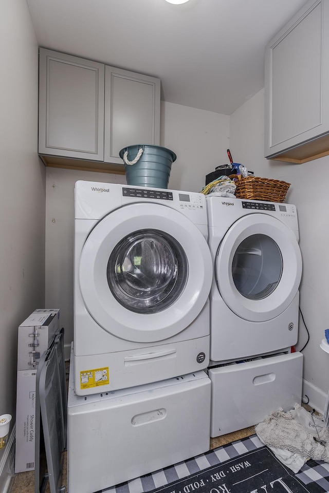 701 Sprucewood Dr, Lexington, KY 40514 - laundry room with cabinet space and washing machine and clothes dryer