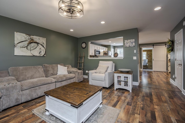 701 Sprucewood Dr, Lexington, KY 40514 - living room with a barn door, dark wood-style flooring, recessed lighting, a chandelier, and baseboards