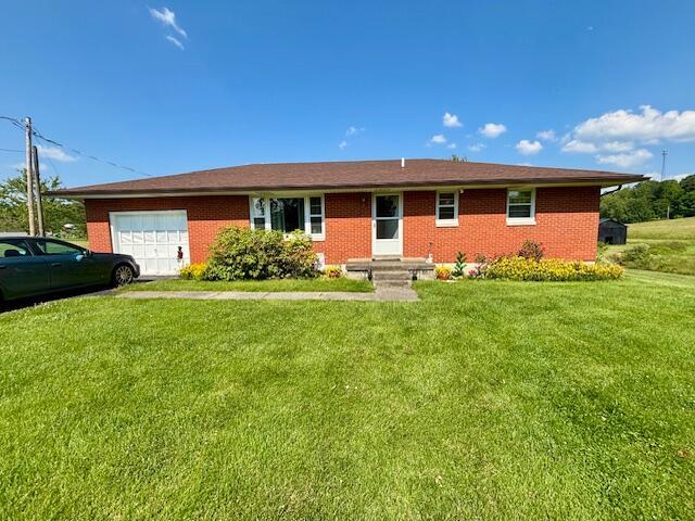 54 Kelley Rd, Mckee, KY 40447 - single story home featuring a garage, a front lawn, and brick siding