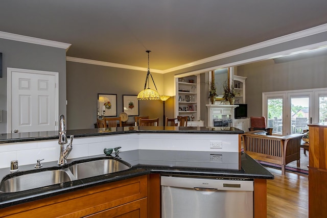 3519 Doral Pl, Lexington, KY 40509 - kitchen featuring stainless steel dishwasher, a sink, crown molding, brown cabinetry, and decorative light fixtures
