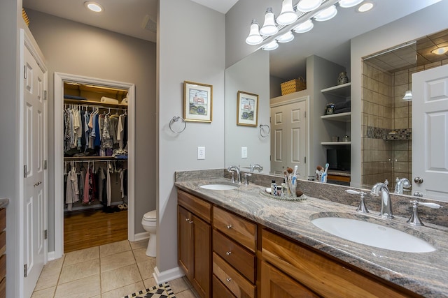 3519 Doral Pl, Lexington, KY 40509 - full bath featuring double vanity, tile patterned flooring, toilet, a spacious closet, and recessed lighting