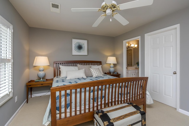 3519 Doral Pl, Lexington, KY 40509 - carpeted bedroom with multiple windows, baseboards, connected bathroom, and ceiling fan