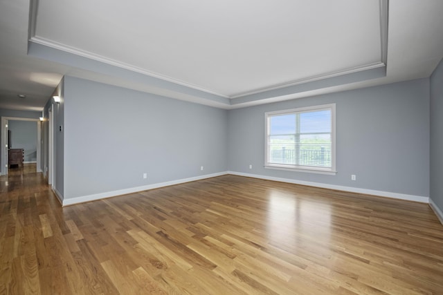 180 Taylors Fork Rd, Richmond, KY 40475 - spare room featuring a raised ceiling, ornamental molding, wood finished floors, and baseboards
