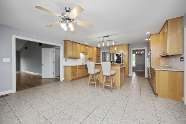 180 Taylors Fork Rd, Richmond, KY 40475 - kitchen featuring stainless steel fridge, light tile patterned floors, a kitchen island, backsplash, and recessed lighting
