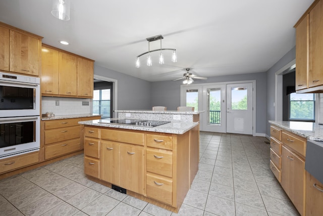 180 Taylors Fork Rd, Richmond, KY 40475 - kitchen with double oven, ceiling fan, black electric cooktop, light tile patterned floors, and decorative backsplash