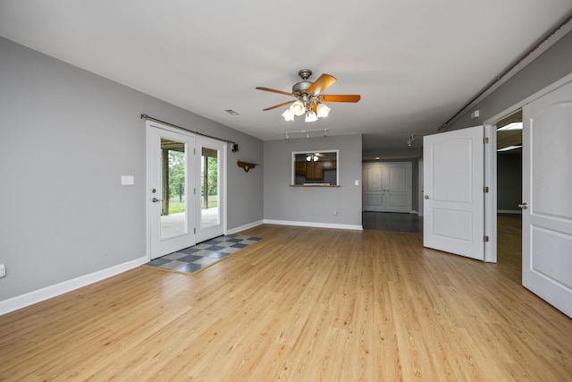 180 Taylors Fork Rd, Richmond, KY 40475 - unfurnished living room featuring light wood-style flooring, ceiling fan, and baseboards