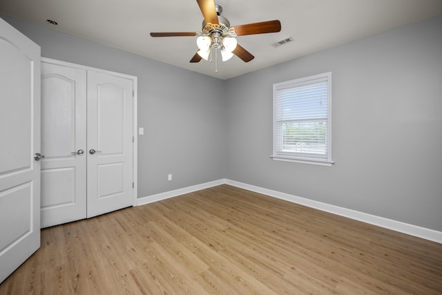 180 Taylors Fork Rd, Richmond, KY 40475 - unfurnished bedroom with light wood finished floors, baseboards, a closet, and ceiling fan