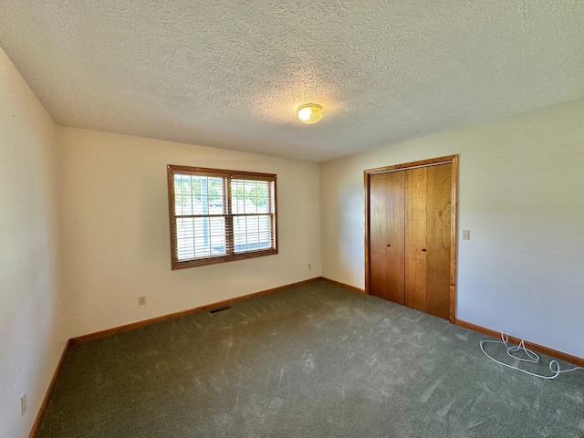 7532 Maysville Rd, Carlisle, KY 40311 - unfurnished bedroom featuring carpet, baseboards, a closet, and a textured ceiling