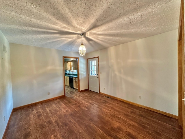 7532 Maysville Rd, Carlisle, KY 40311 - spare room with dark wood-type flooring, baseboards, and a textured ceiling
