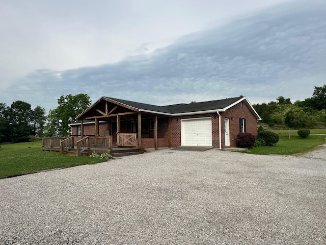 7532 Maysville Rd, Carlisle, KY 40311 - view of front of property with driveway, an attached garage, covered porch, and a front lawn