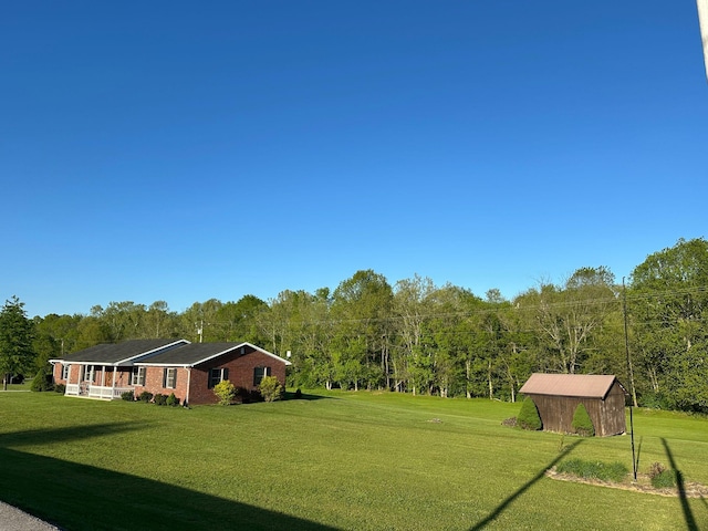 7532 Maysville Rd, Carlisle, KY 40311 - view of grassy yard with a wooded view