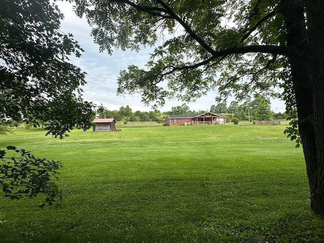 7532 Maysville Rd, Carlisle, KY 40311 - view of green lawn featuring an outbuilding